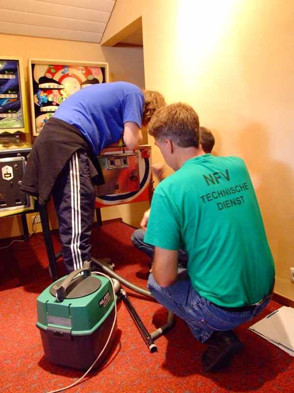 Forcing open a coin door with a screwdriver