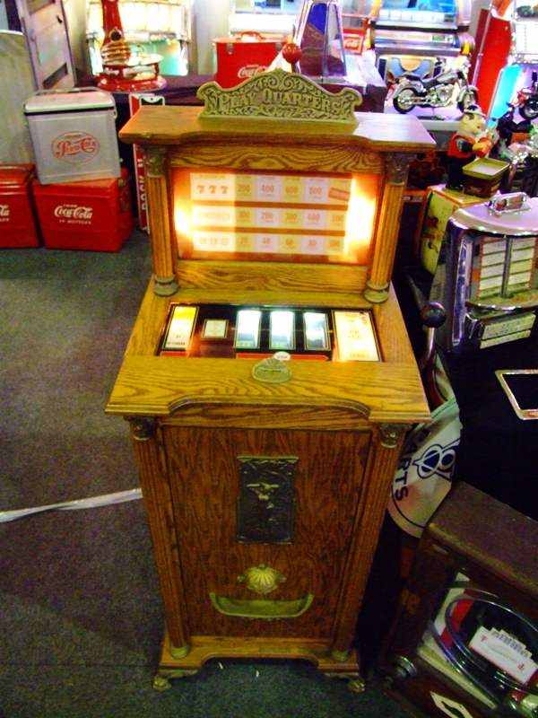 vintage slot machine in wood cabinet
