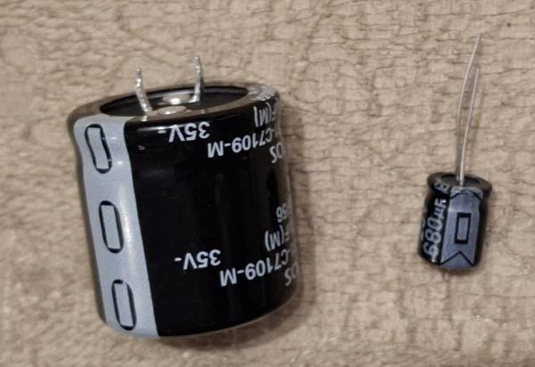 negative side of capacitors