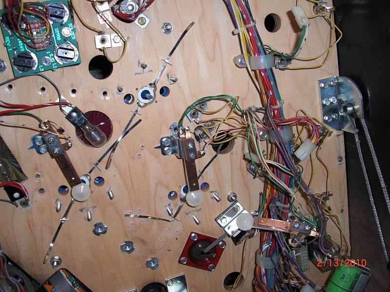 under playfield wiring of lamp sockets in bumpers